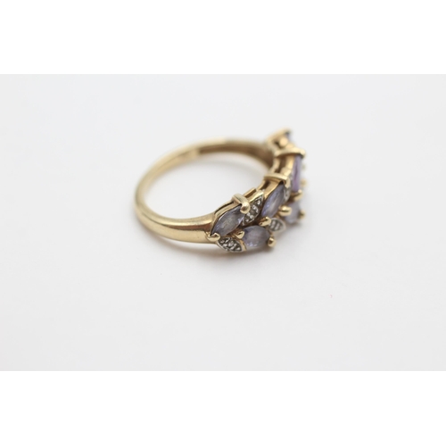 2065 - A 9ct gold tanzanite and diamond stylised floral dress ring, size K - approx. gross weight 2.6 grams