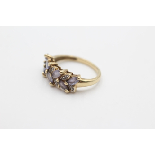 2065 - A 9ct gold tanzanite and diamond stylised floral dress ring, size K - approx. gross weight 2.6 grams