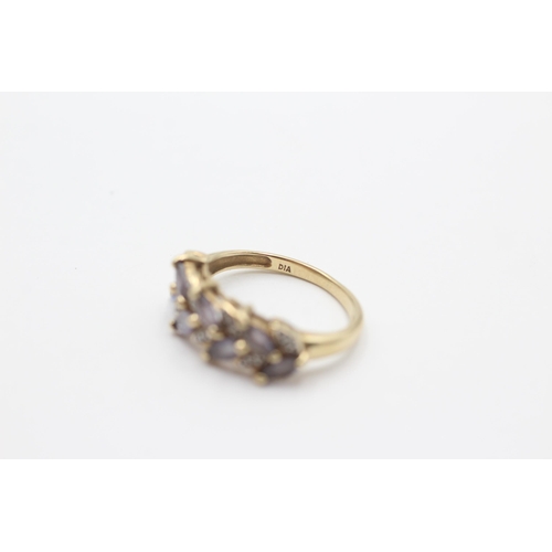 2065 - A 9ct gold tanzanite and diamond stylised floral dress ring, size K - approx. gross weight 2.6 grams