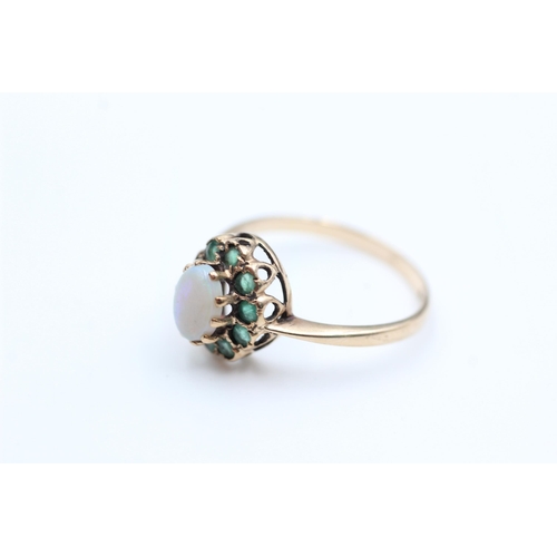 2072 - A 9ct gold opal and emerald halo dress ring, size Q - approx. gross weight 2.2 grams