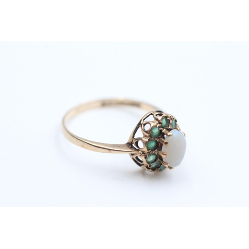 2072 - A 9ct gold opal and emerald halo dress ring, size Q - approx. gross weight 2.2 grams