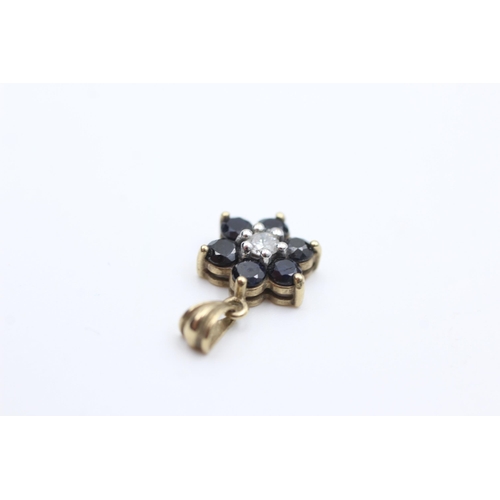 2073 - A 9ct gold diamond and sapphire floral cluster pendant - approx. gross weight 1.1 grams