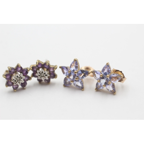 2082 - Two pairs of 9ct gold gemstone star stud earrings, one tanzanite and one amethyst and diamond - appr... 