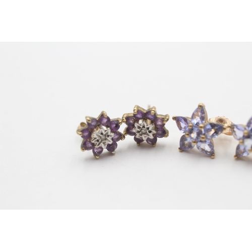 2082 - Two pairs of 9ct gold gemstone star stud earrings, one tanzanite and one amethyst and diamond - appr... 