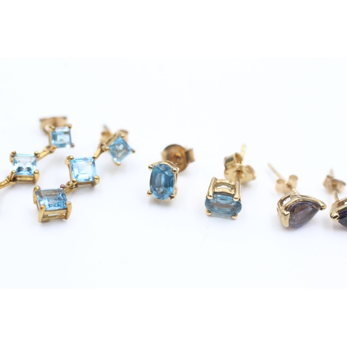 2085 - Three pairs of 9ct gold gemstone stud earrings, two topaz and one iolite - approx. gross weight 4.2 ... 