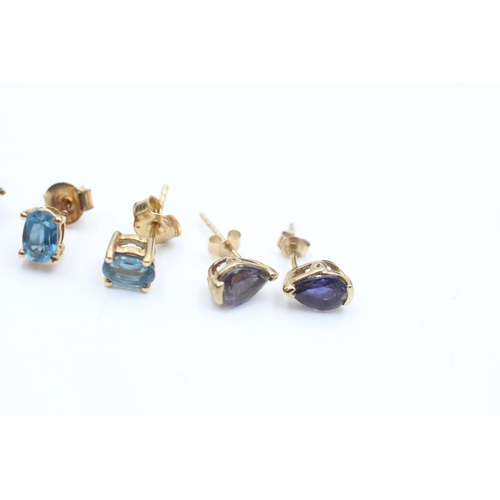 2085 - Three pairs of 9ct gold gemstone stud earrings, two topaz and one iolite - approx. gross weight 4.2 ... 