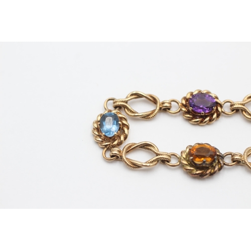 2086 - A 9ct gold amethyst, zircon, peridot, citrine, topaz and garnet rope link bracelet - approx. gross w... 