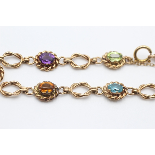 2086 - A 9ct gold amethyst, zircon, peridot, citrine, topaz and garnet rope link bracelet - approx. gross w... 