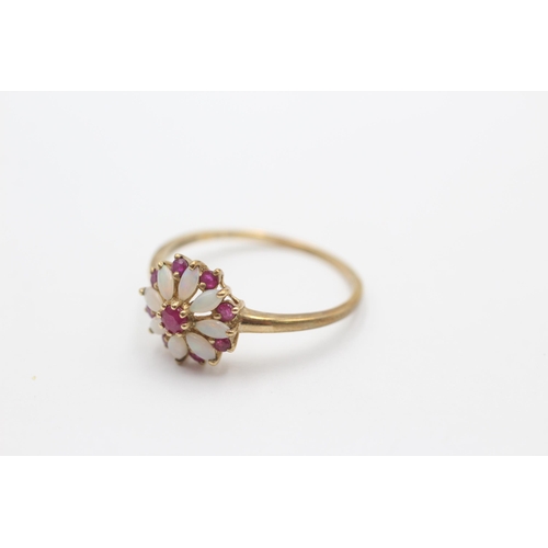 2090 - A 9ct gold ruby and opal floral ring, size V - approx. gross weight 2.1 grams