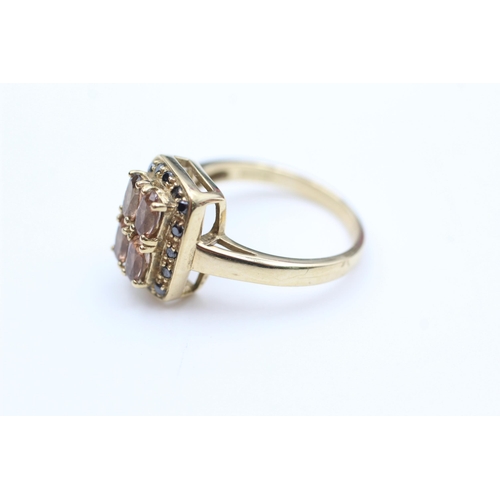 2100 - A 9ct gold black moissanite and topaz cluster dress ring, size N½ - approx. gross weight 4.1 grams