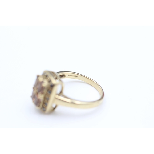 2100 - A 9ct gold black moissanite and topaz cluster dress ring, size N½ - approx. gross weight 4.1 grams