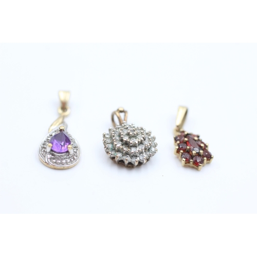 2109 - Three 9ct gold gemstone set pendants, one amethyst, one garnet and one diamond - approx. gross weigh... 