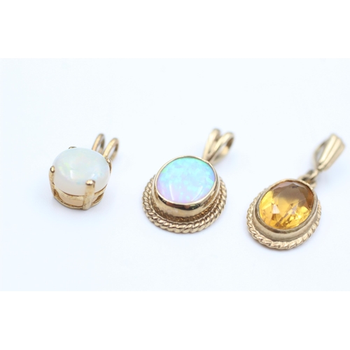 2110 - Three 9ct gold gemstone solitaire pendants, two opal and one citrine - approx. gross weight 3.9 gram... 