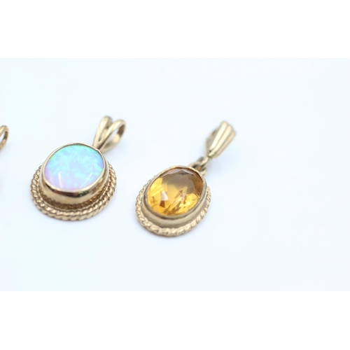 2110 - Three 9ct gold gemstone solitaire pendants, two opal and one citrine - approx. gross weight 3.9 gram... 