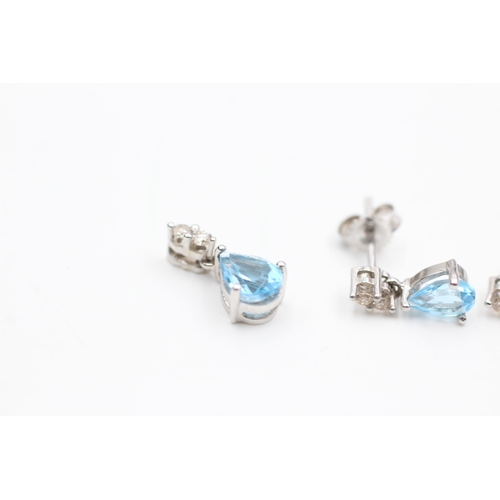 2112 - A 9ct white gold blue topaz and diamond pendant and earrings set - approx. gross weight 1.6 grams