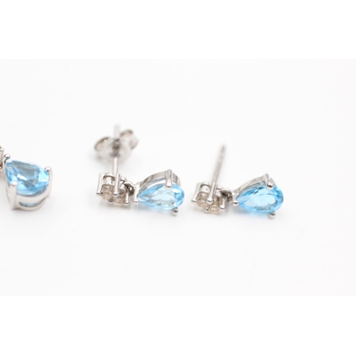 2112 - A 9ct white gold blue topaz and diamond pendant and earrings set - approx. gross weight 1.6 grams