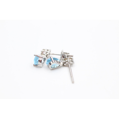 2112 - A 9ct white gold blue topaz and diamond pendant and earrings set - approx. gross weight 1.6 grams