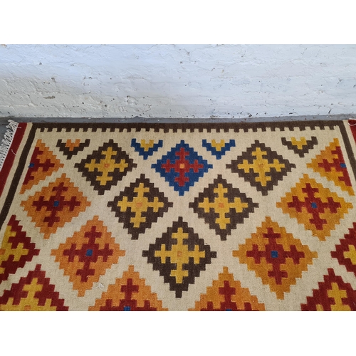18 - A mid 20th century hand knotted Kilim rug - approx. 182cm long x 120cm wide