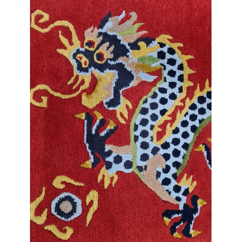 19A - A Chinese hand knotted rug with dragon design - approx. 88cm long x 59cm wide
