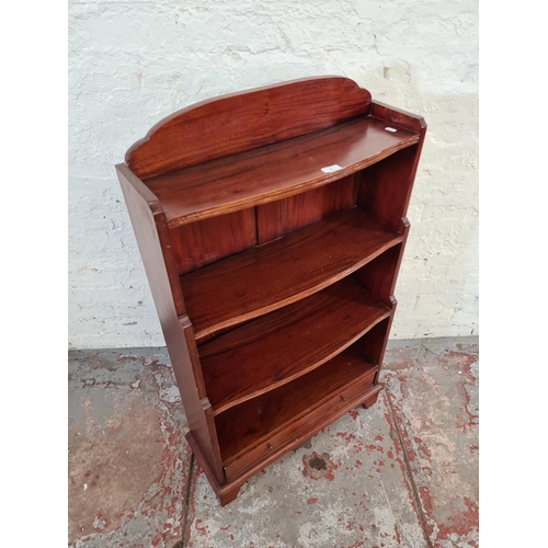 43 - A Georgian style mahogany four tier waterfall bookcase with two lower drawers - approx. 115cm high x... 