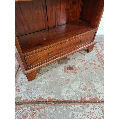43 - A Georgian style mahogany four tier waterfall bookcase with two lower drawers - approx. 115cm high x... 