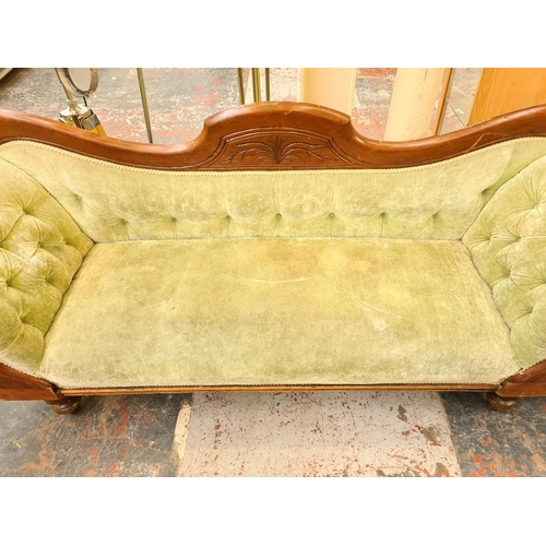 55 - A late 19th century mahogany and green fabric upholstered double ended sofa - approx. 89cm high x 21... 