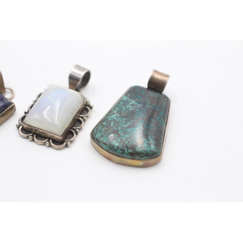 2186 - Four .925 silver gemstone pendants to include moonstone, lapis lazuli etc. - approx. gross weight 52... 