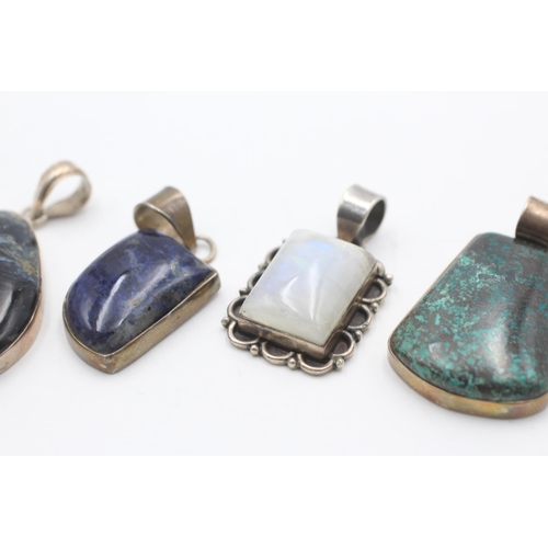 2186 - Four .925 silver gemstone pendants to include moonstone, lapis lazuli etc. - approx. gross weight 52... 