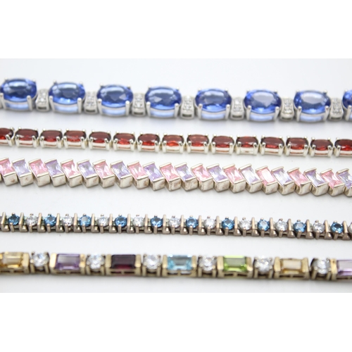 2188 - Five .925 silver tennis bracelets to include garnet, cubic zirconia - approx. gross weight 87 grams