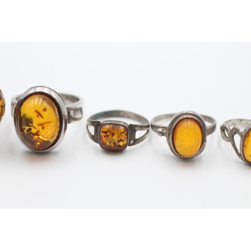 2194 - Five .925 silver amber rings - approx. gross weight 23 grams