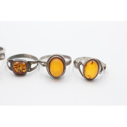 2194 - Five .925 silver amber rings - approx. gross weight 23 grams