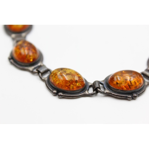 2196 - Two pieces of Modernist .925 silver amber jewellery, one necklace and one bracelet - approx. gross w... 