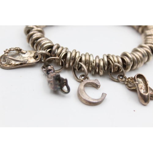 2199 - A Links Of London .925 silver bracelet with charms - approx. gross weight 63 grams