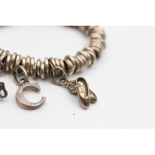 2199 - A Links Of London .925 silver bracelet with charms - approx. gross weight 63 grams