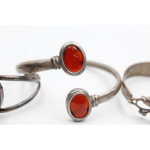 2206 - Three .925 silver gemstone bangles to include carnelian, onyx etc. - approx. gross weight 59 grams