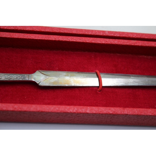 2319 - A boxed Cooper Brothers & Sons hallmarked Sheffield silver Celtic letter opener, dated 1973 - approx... 