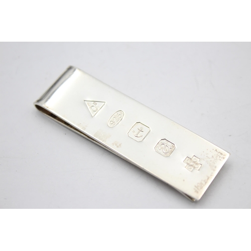 2325 - A hallmarked sterling silver Millenium money clip - approx. gross weight 24 grams and 6.5cm long