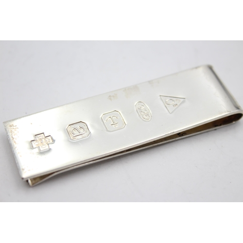 2325 - A hallmarked sterling silver Millenium money clip - approx. gross weight 24 grams and 6.5cm long