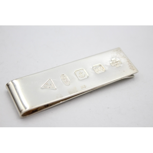 2325 - A hallmarked sterling silver Millenium money clip - approx. gross weight 24 grams and 6.5cm long