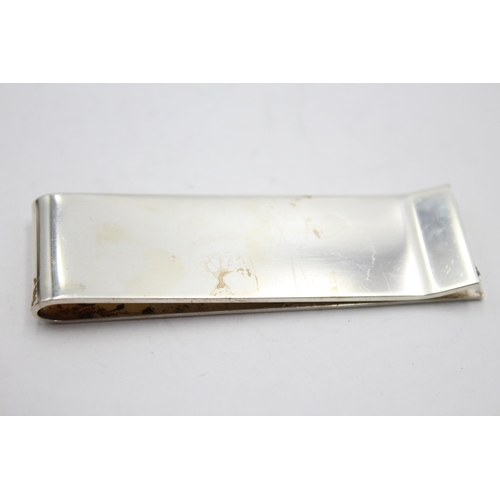 2325 - A hallmarked sterling silver Millenium money clip - approx. gross weight 24 grams and 6.5cm long