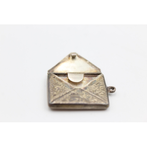 2330 - A George V hallmarked Chester silver stamp case pendant, dated 1912 - approx. gross weight 3 grams a... 