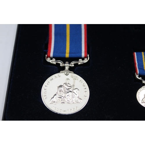 2331 - Two boxed medals, one National Service with miniature and one Elizabeth II Imperial Service