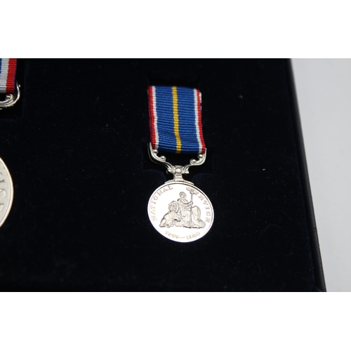 2331 - Two boxed medals, one National Service with miniature and one Elizabeth II Imperial Service