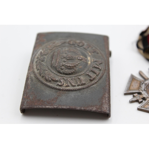 2353 - Three pieces of WWI German militaria, one belt buckle, one Iron Cross 2nd Class and one 1914-18 meda... 