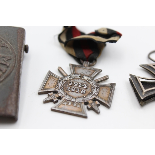 2353 - Three pieces of WWI German militaria, one belt buckle, one Iron Cross 2nd Class and one 1914-18 meda... 