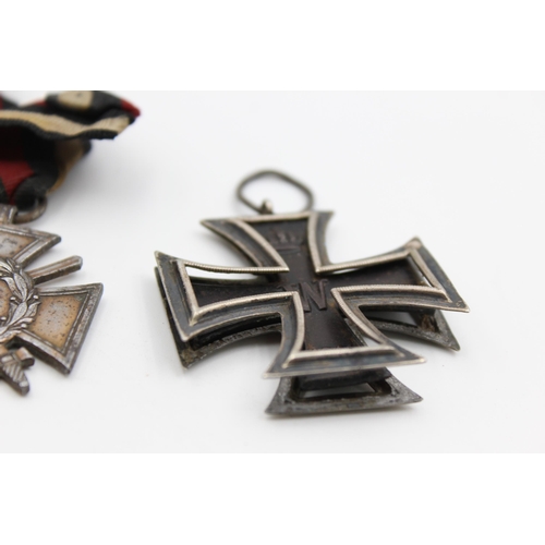 2353 - Three pieces of WWI German militaria, one belt buckle, one Iron Cross 2nd Class and one 1914-18 meda... 