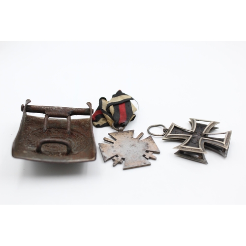 2353 - Three pieces of WWI German militaria, one belt buckle, one Iron Cross 2nd Class and one 1914-18 meda... 