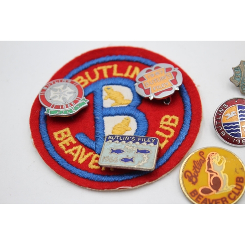 2366 - Nine vintage Butlins items, eight badges and one cloth patch