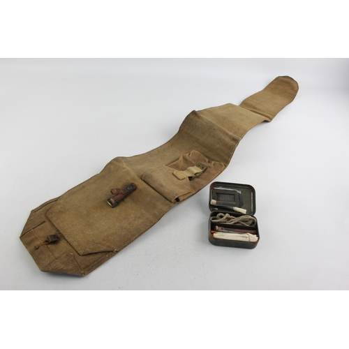 495 - A WWII era canvas rifle case and cleaning kit, case marked A.M.C44 and kit dated 1945