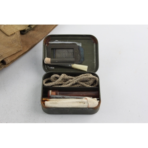 495 - A WWII era canvas rifle case and cleaning kit, case marked A.M.C44 and kit dated 1945